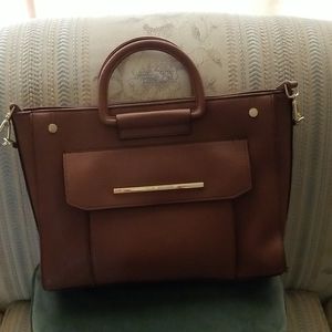 Steve Madden purse with shoulder strap.